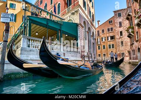 VENICE, ITALY - MAY 21, 2017: Gondolas and beautiful buildings on the canals of Venice, Italy. Stock Photo