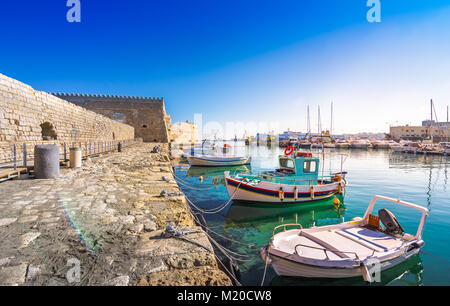 Heraklion harbour with old venetian fort Koule and shipyards, Crete, Greece Stock Photo
