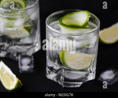 gin tonic with cucumber, lime and ice in glass Stock Photo