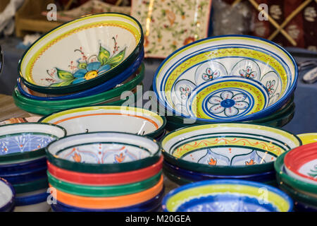 hand-painted dishes of a multitude of colors in a traditional art market Stock Photo