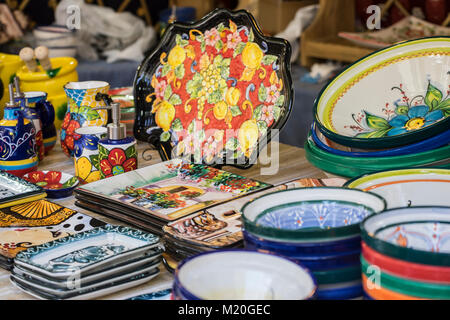 hand-painted dishes of a multitude of colors in a traditional art market Stock Photo