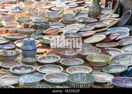 Decorative, hand-painted dishes of a multitude of colors in a traditional art market Stock Photo