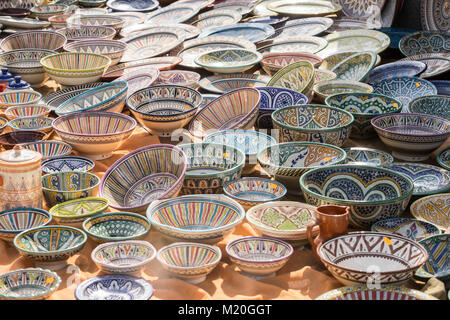 hand-painted dishes of a multitude of colors in a traditional art market Stock Photo