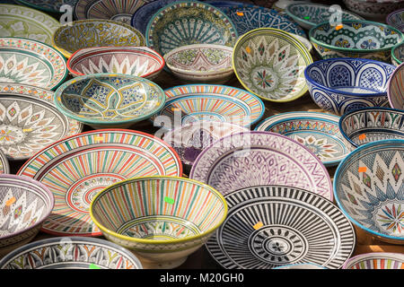 hand-painted dishes of a multitude of colors in a traditional art market Stock Photo