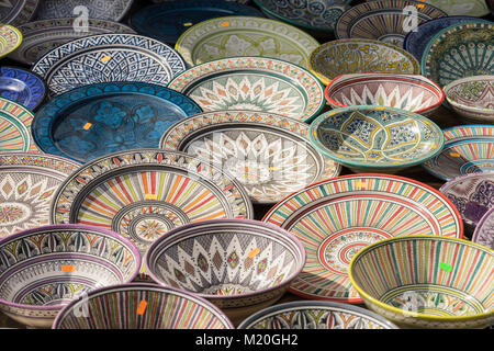 Decorative, hand-painted dishes of a multitude of colors in a traditional art market Stock Photo