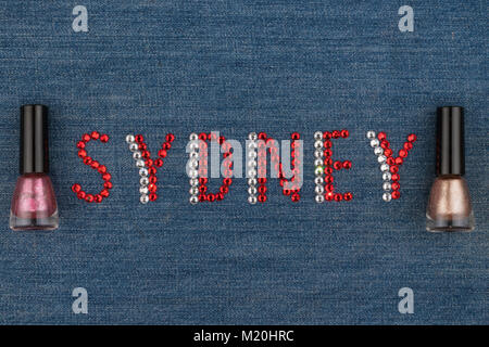 Word Sydney, made of rhinestones, encrusted on denim. World Fashion. View from above Stock Photo
