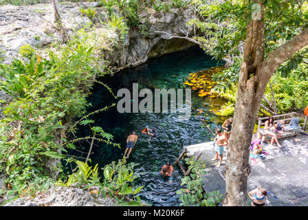 Tulum, Quintana Roo, Mexico, Tourists swimming in Sacred Cenote in tulum Stock Photo