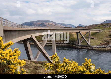 Kylesku Bridge, a distinctively curved concrete box girder bridge in north-west Scotland that crosses the Loch a' Chàirn Bhàin in Sutherland. Stock Photo