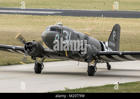 EINDHOVEN, THE NETHERLANDS - SEP 17, 2016: World War II Dakota C-47 cargo plane in US Air Force colours taxiing after landing on Eindhoven airbase. Stock Photo