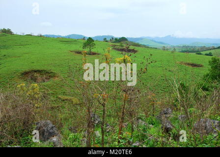 Bomb craters from the Vietnam War surround giant megalithic stone urns at the Plain of Jars archaeological site in Loas. This area is the world's most Stock Photo