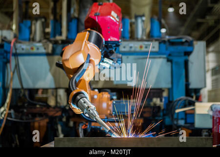 Movement of robot welding in factory Stock Photo