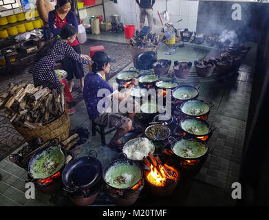 An Giang, Vietnam - Sep 2, 2017. People cooking traditional cake in An Giang, Vietnam. An Giang Province is located to the west of the Mekong Delta. Stock Photo