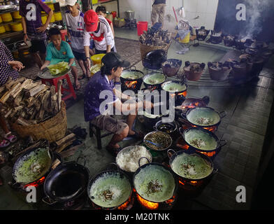 An Giang, Vietnam - Sep 2, 2017. A man cooking traditional cake in An Giang, Vietnam. An Giang Province is located to the west of the Mekong Delta. Stock Photo