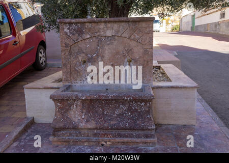 Water Fountain made from local Marble in the street in Oria, Almeria Province Andalucía Spain Stock Photo