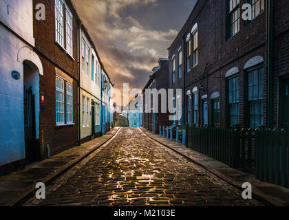 Whitby has many narrow cobbled streets in the old part of the town. Stock Photo