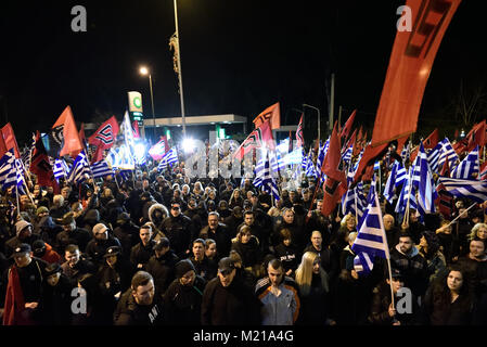 Athens, Greece, 3rd February, 2018. Golden Dawn supporters wave flags and chant slogans in front of the party's headquarters to commemorate the death of three Greek officers in 1996 during the Imia crisis that brought Greece and Turkey to the brink of war in Athens, Greece. Credit: Nicolas Koutsokostas/Alamy Live News. Stock Photo