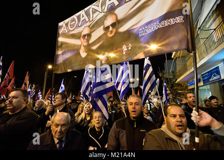 Athens, Greece, 3rd February, 2018. Golden Dawn supporters wave flags and chant slogans in front of the party's headquarters to commemorate the death of three Greek officers in 1996 during the Imia crisis that brought Greece and Turkey to the brink of war in Athens, Greece. Credit: Nicolas Koutsokostas/Alamy Live News. Stock Photo
