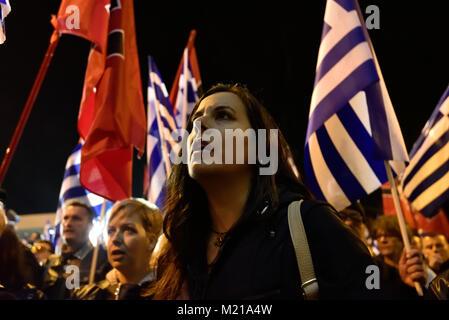 Athens, Greece, 3rd February, 2018. Golden Dawn supporters wave flags and chant slogans in front of the party's headquarters to commemorate the death of three Greek officers in 1996 during the Imia crisis that brought Greece and Turkey to the brink of war in Athens, Greece. Credit: Nicolas Koutsokostas/Alamy Live News. Stock Photo