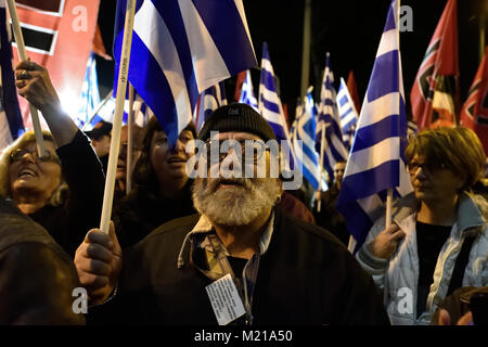 Athens, Greece, 3rd February, 2018. Golden Dawn supporters wave flags and chant slogans in front of the party's headquarters to commemorate the death of three Greek officers in 1996 during the Imia crisis that brought Greece and Turkey to the brink of war in Athens, Greece. Credit: Nicolas Koutsokostas/Alamy Live News. Stock Photo