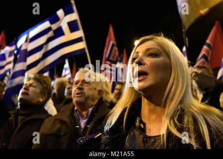 Athens, Greece, 3rd February, 2018. Golden Dawn supporters wave flags and chant slogans in front of the party's headquarters to commemorate the death of three Greek officers in 1996 during the Imia crisis that brought Greece and Turkey to the brink of war in Athens, Greece. Credit: Nicolas Koutsokostas/Alamy Live News. Stock Photo