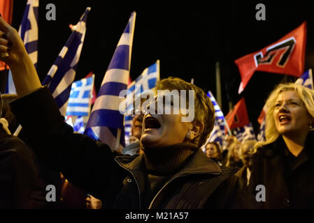 Athens, Greece, 3rd February, 2018. Golden Dawn supporters wave flags and chant slogans in front of the party's headquarters to commemorate the death of three Greek officers in 1996 during the Imia crisis that brought Greece and Turkey to the brink of war in Athens, Greece. Credit: Nicolas Koutsokostas/Alamy Live News. Stock Photo