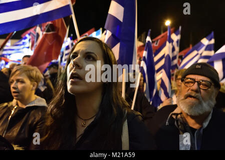 Athens, Greece, 3rd February, 2018. Golden Dawn supporters wave flags and chant slogans in front of the party's headquarters to commemorate the death of three Greek officers in 1996 during the Imia crisis that brought Greece and Turkey to the brink of war in Athens, Greece. Credit: Nicolas Koutsokostas/Alamy Live News. Stock Photo