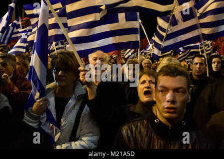Athens, Greece, 3rd February, 2018. Golden Dawn supporters wave flags and chant slogans in front of the party's headquarters to commemorate the death of three Greek officers in 1996 during the Imia crisis that brought Greece and Turkey to the brink of war in Athens, Greece. Credit: Nicolas Koutsokostas/Alamy Live News. Stock Photo
