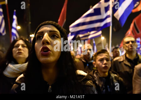 Athens, Greece, 3rd February, 2018. Golden Dawn supporters wave flags and chant slogans in front of the party's headquarters to commemorate the death of three Greek officers in 1996 during the Imia crisis that brought Greece and Turkey to the brink of war in Athens, Greece. Credit: Nicolas Koutsokostas/Alamy Live News. Stock Photo