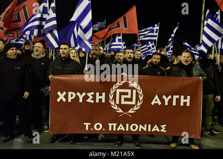 Athens, Greece, 3rd February, 2018. Golden Dawn supporters wave flags and chant slogans in front of the Ministry of Defence to commemorate the death of three Greek officers in 1996 during the Imia crisis that brought Greece and Turkey to the brink of war in Athens, Greece. Credit: Nicolas Koutsokostas/Alamy Live News. Stock Photo