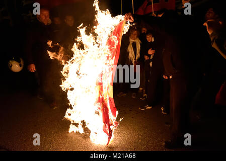 Athens, Greece, 3rd February, 2018. Golden Dawn supporters burn the flag of FYROM in front of the Ministry of Defence during the rally to commemorate the death of three Greek officers in 1996 during the Imia crisis that brought Greece and Turkey to the brink of war in Athens, Greece. Credit: Nicolas Koutsokostas/Alamy Live News. Stock Photo