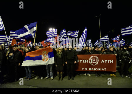 Athens, Greece, 3rd February, 2018. Golden Dawn supporters wave flags and chant slogans in front of the Ministry of Defence to commemorate the death of three Greek officers in 1996 during the Imia crisis that brought Greece and Turkey to the brink of war in Athens, Greece. Credit: Nicolas Koutsokostas/Alamy Live News. Stock Photo
