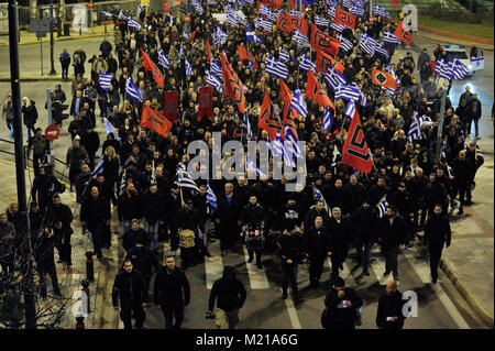 Athens, Greece, 3rd February, 2018. Golden Dawn supporters wave flags and chant slogans as they march towards the Ministry of Defence to commemorate the death of three Greek officers in 1996 during the Imia crisis that brought Greece and Turkey to the brink of war in Athens, Greece. Credit: Nicolas Koutsokostas/Alamy Live News. Stock Photo