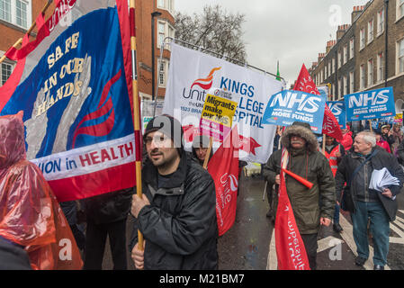 London, UK. 3rd February 2018. Tens of thousands march in support of the NHS through London to a rally at Downing St calling on the Government to stop blaming patients, nurses, doctors, immigrants, flu and the elderly for the crisis in the health service and to fund it properly and bring it back into public hands from the waste and demands of private profit. Outsourcing of services has damaged the efficiency of the NHS and created dangerously low standards of hygiene, while expensive PFI building contracts have left many hospital trusts with impossible long-term debt repayments. THe event was  Stock Photo