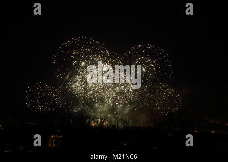Colorful fireworks against black sky in the night Stock Photo