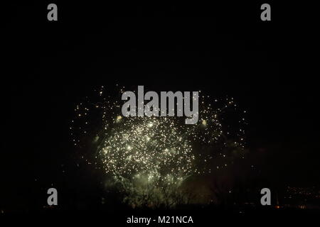 Colorful fireworks against black sky in the night Stock Photo
