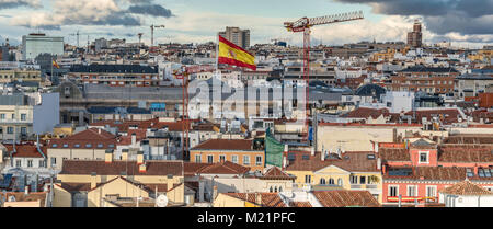 Madrid skyline sunset view from Cibeles Palace Townhall, Madrid City Council building, big spanish flag on Archaeological Museum and National Library Stock Photo