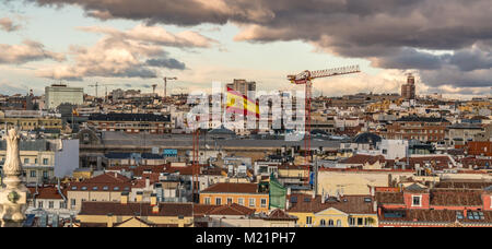 Madrid skyline sunset view from Cibeles Palace Townhall, Madrid City Council building, big spanish flag on Archaeological Museum and National Library Stock Photo