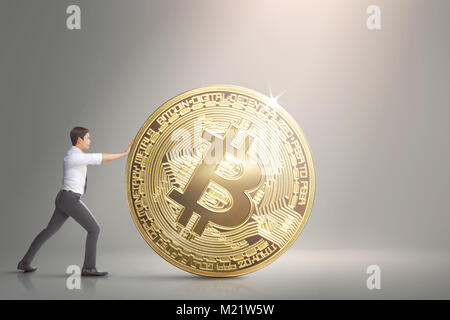 Image of asian business man pushing bitcoin Stock Photo