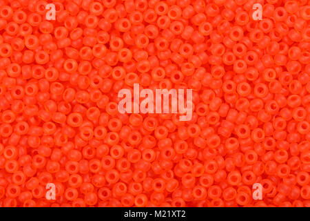 Background of red orange seed beads.  Stock Photo