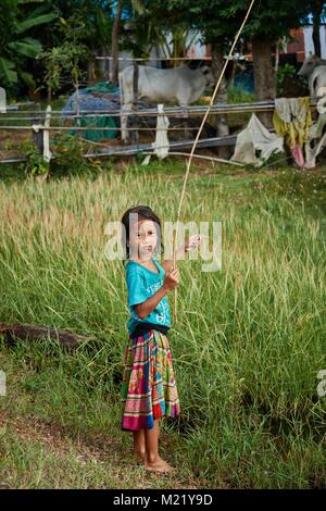 Cambodian girl fishing, Kompong Chhnang, Cambodia Stock Photo