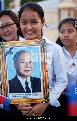 Schoolgirl cheering for Cambodian King, Royal Palace, Phnom Penh, Cambodia Stock Photo