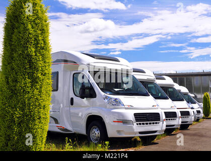 Newly produced motorhomes on a car park in a vehicle factory Stock Photo