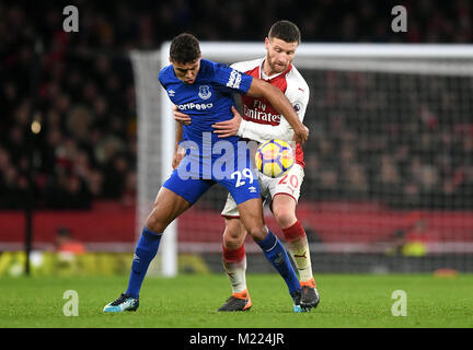 Everton's Dominic Calvert-Lewin (left) and Arsenal's Shkodran Mustafi battle for the ball during the Premier League match at the Emirates Stadium, London. Stock Photo