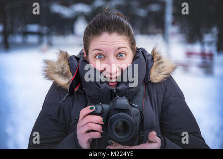 Happy photographer capturing winter images Stock Photo