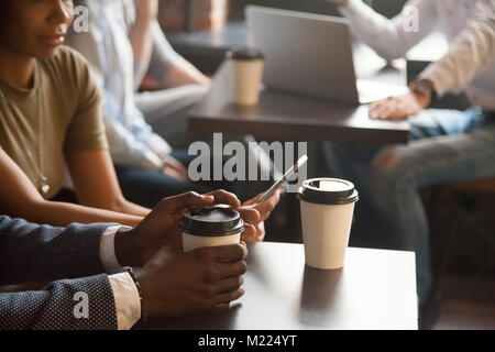 Coffee break in cafe with modern gadgets concept, closeup view Stock Photo