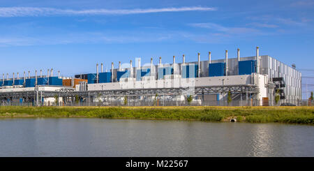 Google Datacenter near Delfzijl in the province of Groningen under blue sky. Stock Photo