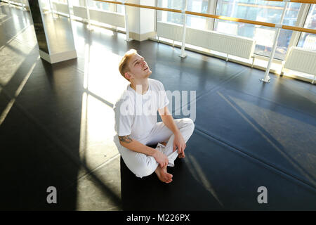 Guy doing drinking water before morning training.  Stock Photo