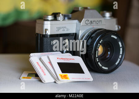 Canon FTB single-lens reflex camera with roll of kodak safety film in foreground Stock Photo
