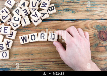 word. Wooden letters on the office desk, informative and communication background Stock Photo