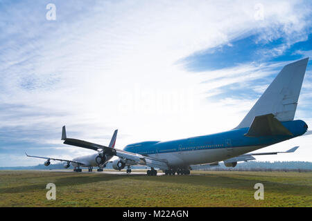 ENSCHEDE, NETHERLANDS - FEBRUARY 3, 2018: Two commercial passenger airplanes to be dismantled on a former military airfield Stock Photo